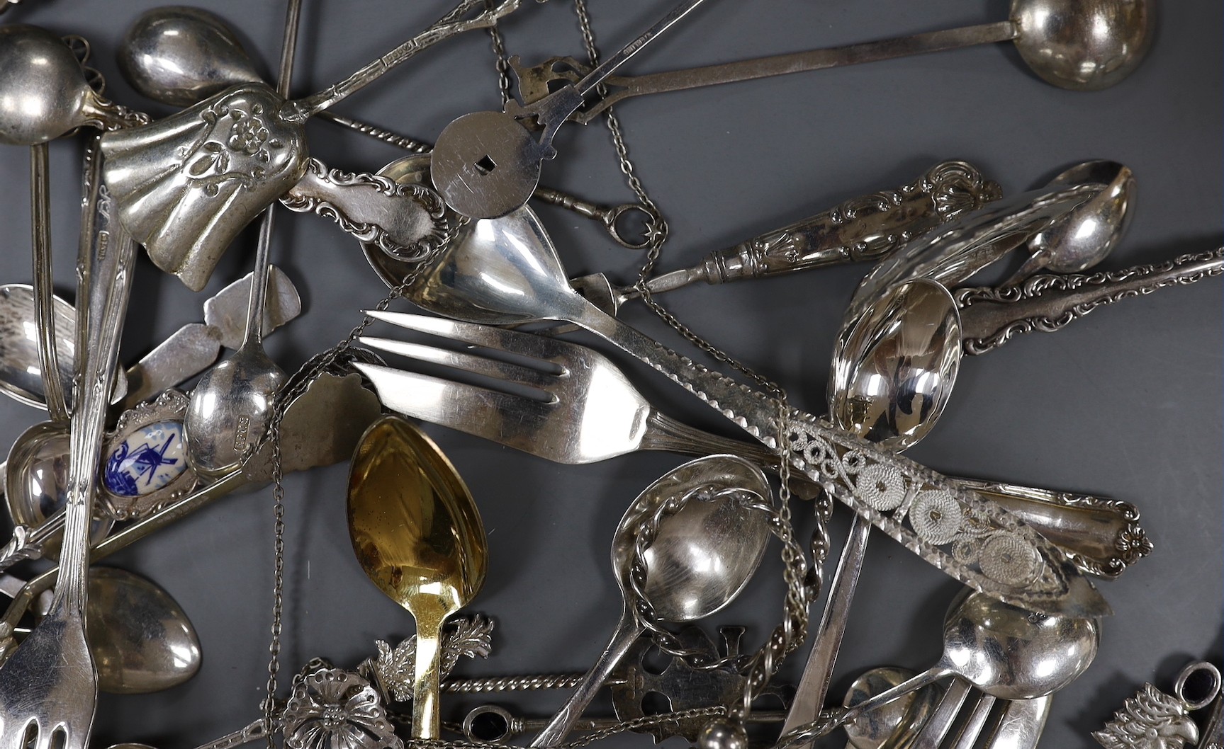 A small quantity of assorted small flatware including sterling, plated, silver and continental white metal including a David Andersen pickle fork.